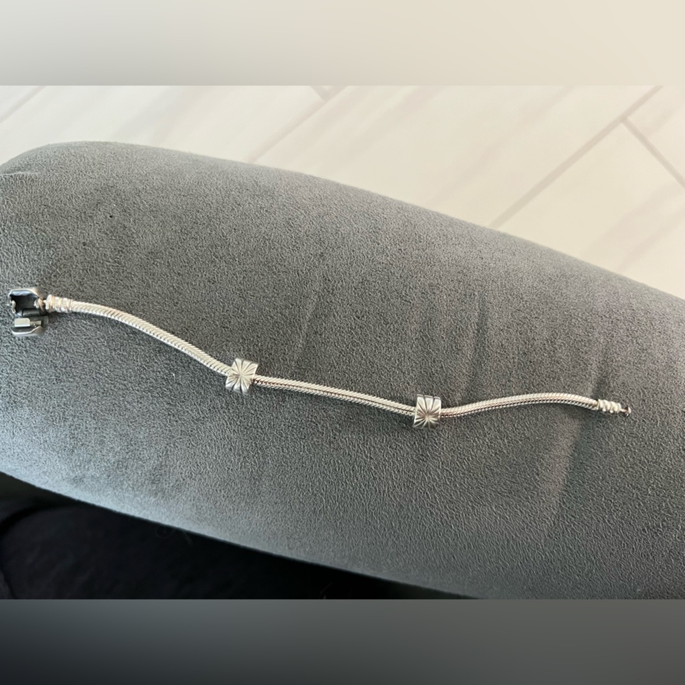 Pandora bracelet with two sunburst clips